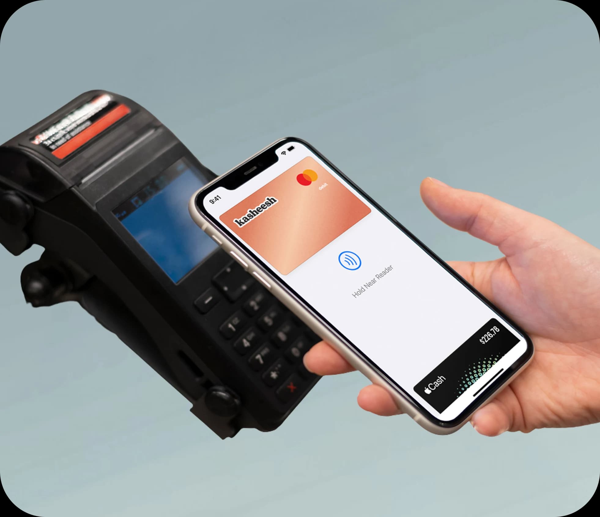 Tapping the Kasheesh card to pay at a store terminal